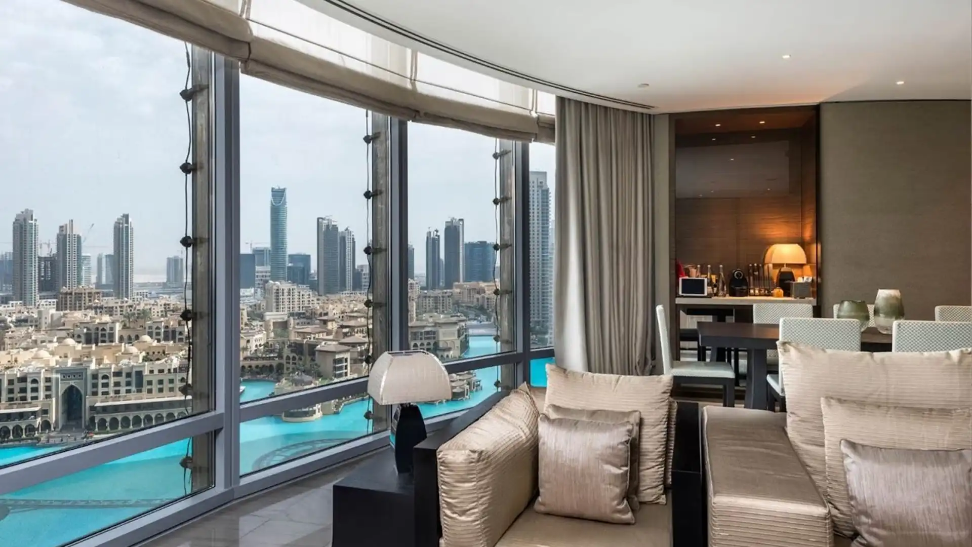 Elegant living room with floor-to-ceiling windows overlooking Downtown Dubai